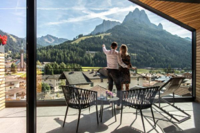 Гостиница Hotel Ladinia Dolomites View  Поцца-Ди-Фасса
